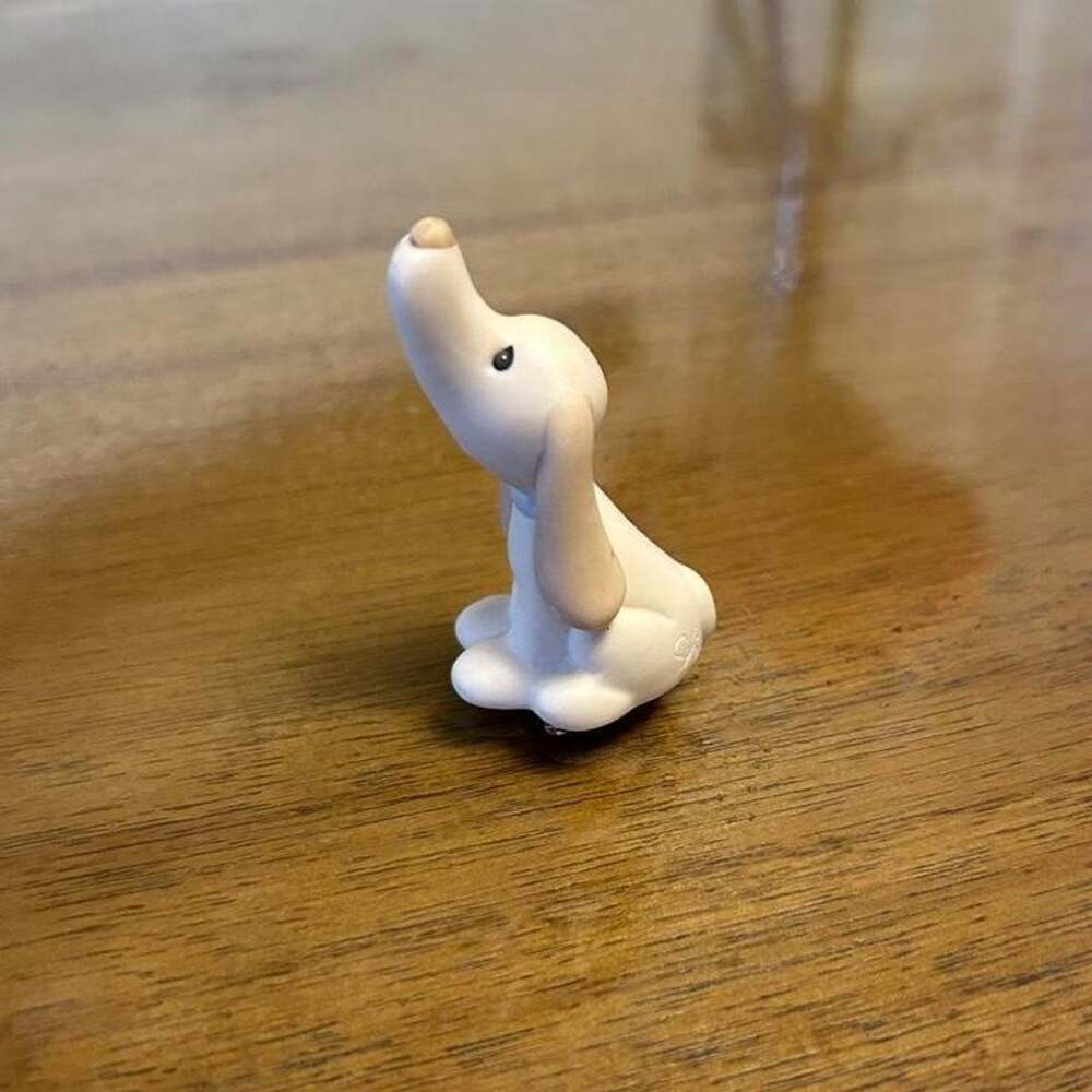 1984 Enesco Precious Moments mini hound dog figurine “He is my song.”
